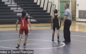 Girl Pins Boy in High School Wrestling